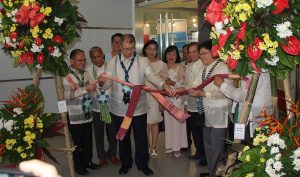 Sec. De La Pena and Engr. Rowen Gelonga with the different SUC Presidents untie the ribbon to formally open the exhibits.