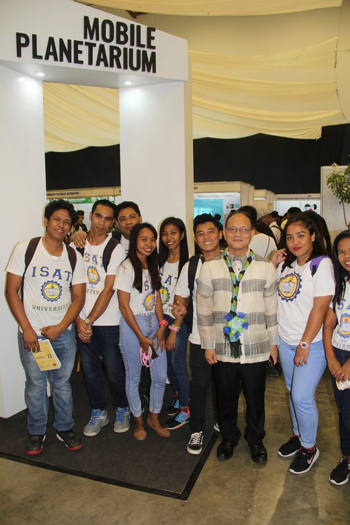 The student enjoy some moment with the university president as they explore the different exhibits.